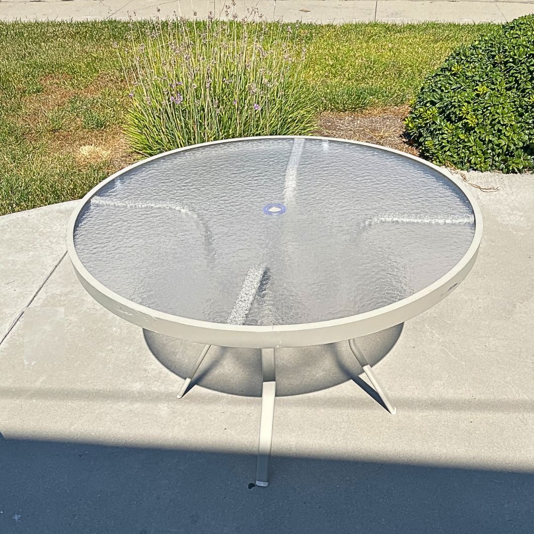 Tan Outdoor Table after glass table top gets replaced with acrylic by patio guys