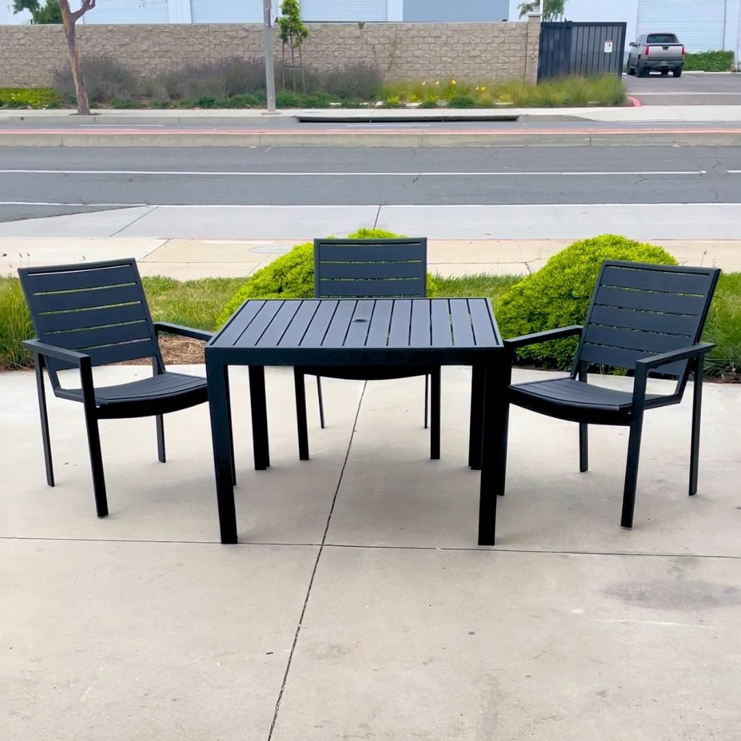All-metal commercial outdoor patio set with table and three chairs. Newly refinished with text black powder coat paint.