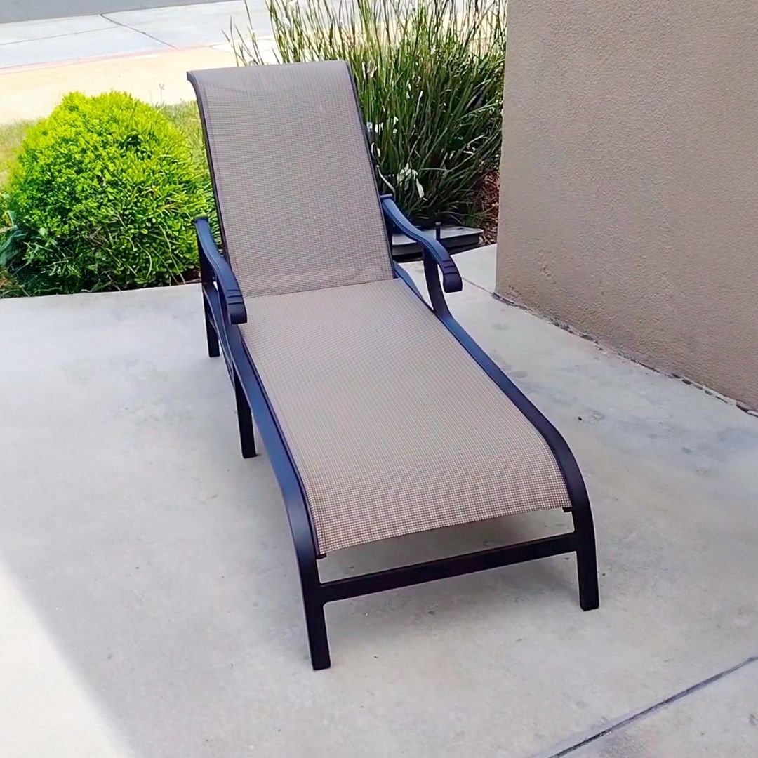 Black Brown Jordan Chaise Lounge with Tan Sling after Outdoor Furniture Restoration by Patio Guys