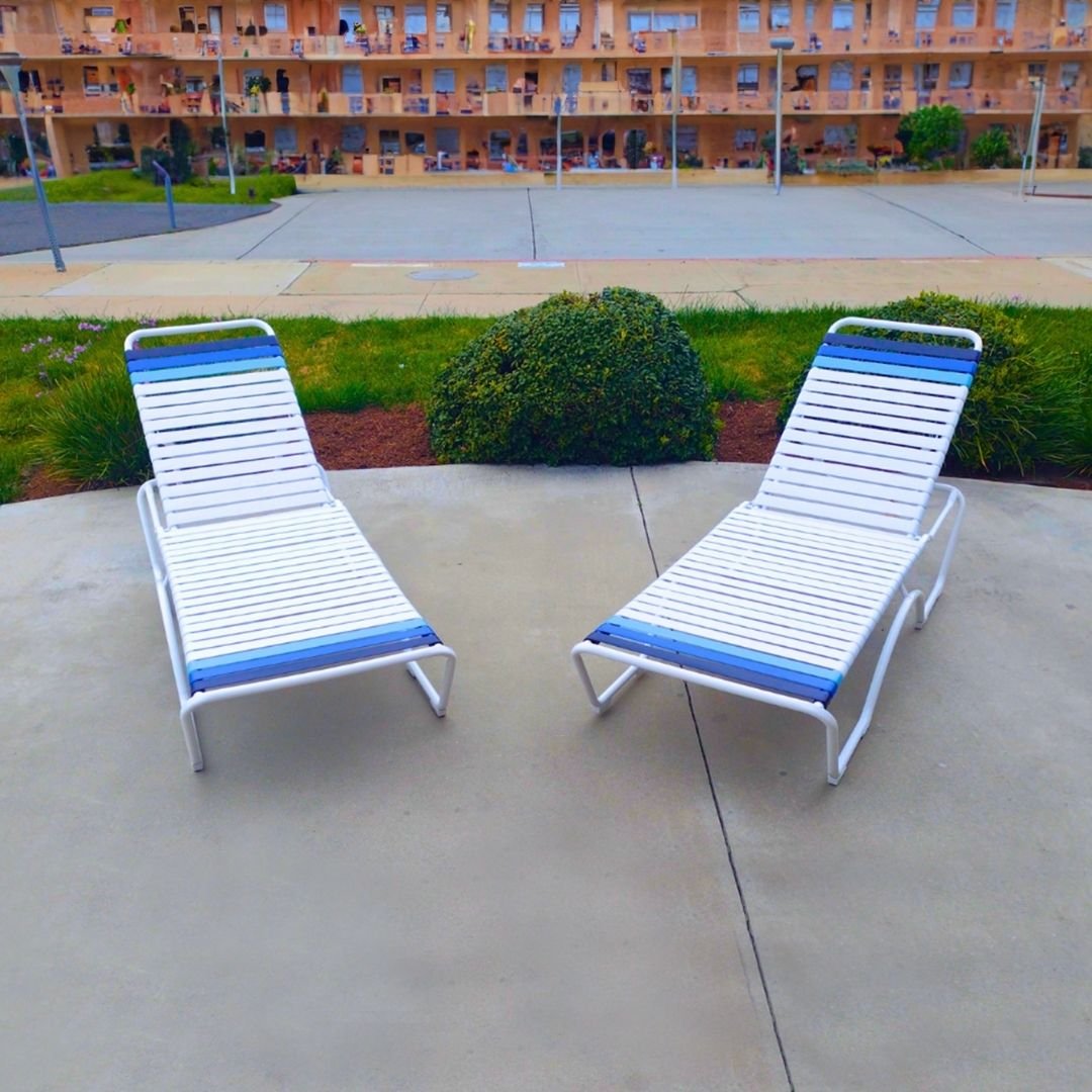 Commercial, white, Vinyl Strap, Pool Lounges with navy blue accent strap in front of a southern California hotel