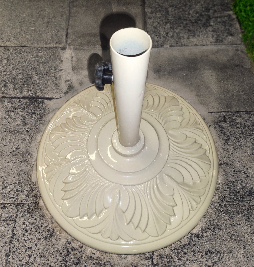 An Ornate White all metal outdoor umbrella base with a new powder coat from patio guys
