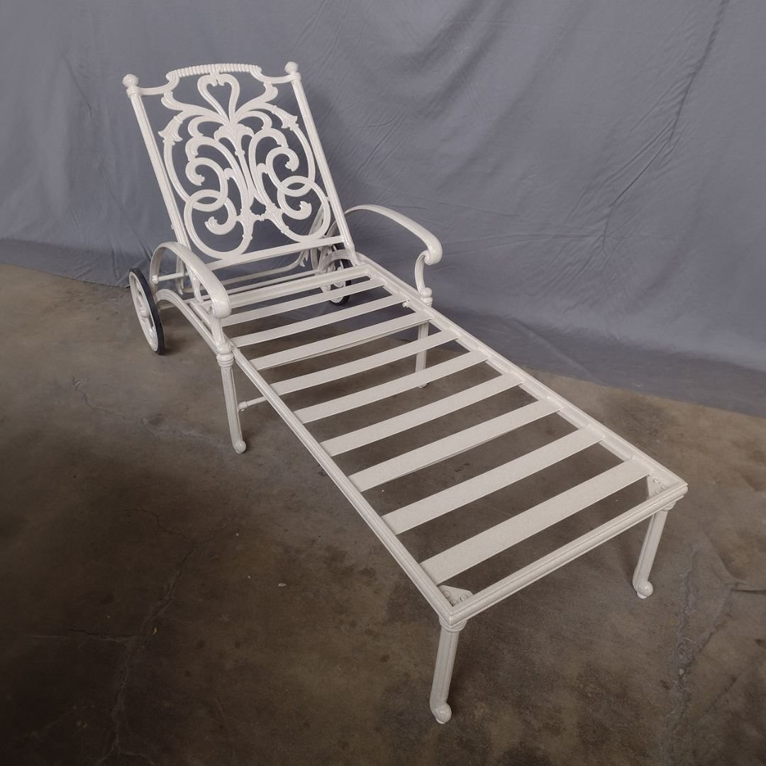 Newly restored, white, vintage chaise lounge with wheels restored by patio guys.
