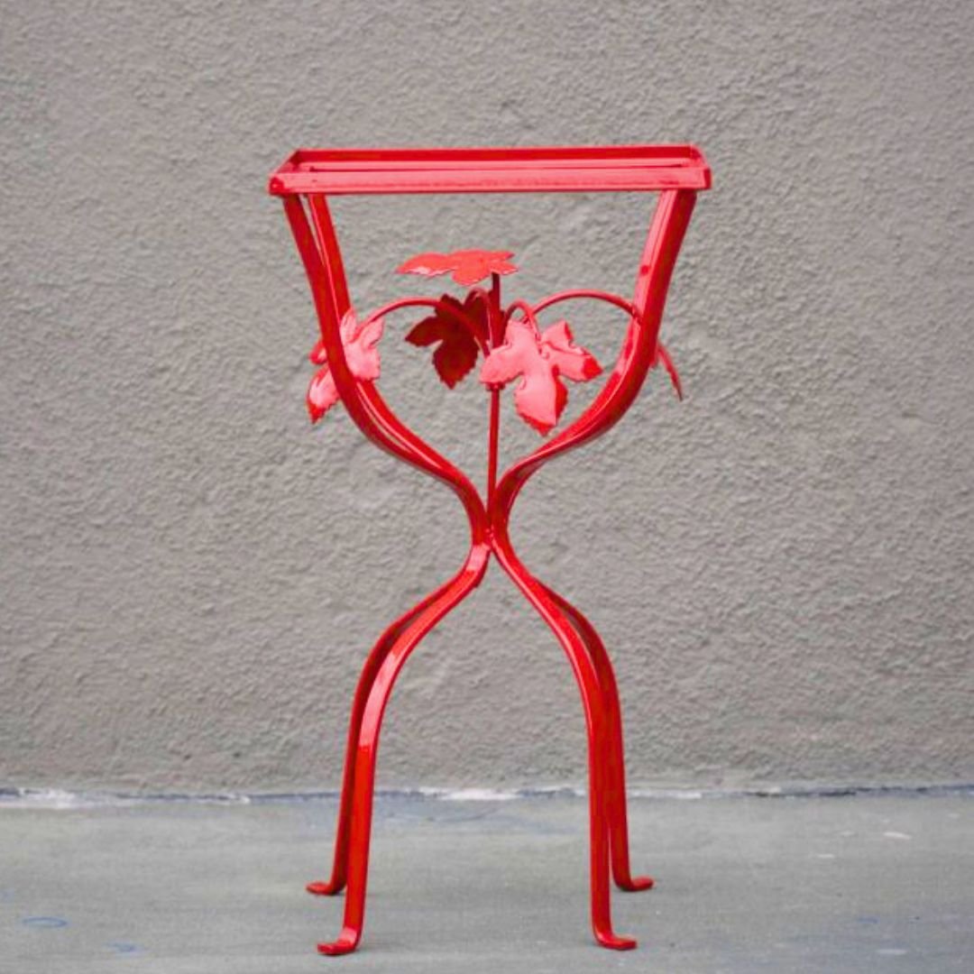 Bright Red ornate outdoor patio side table restored by patio guys