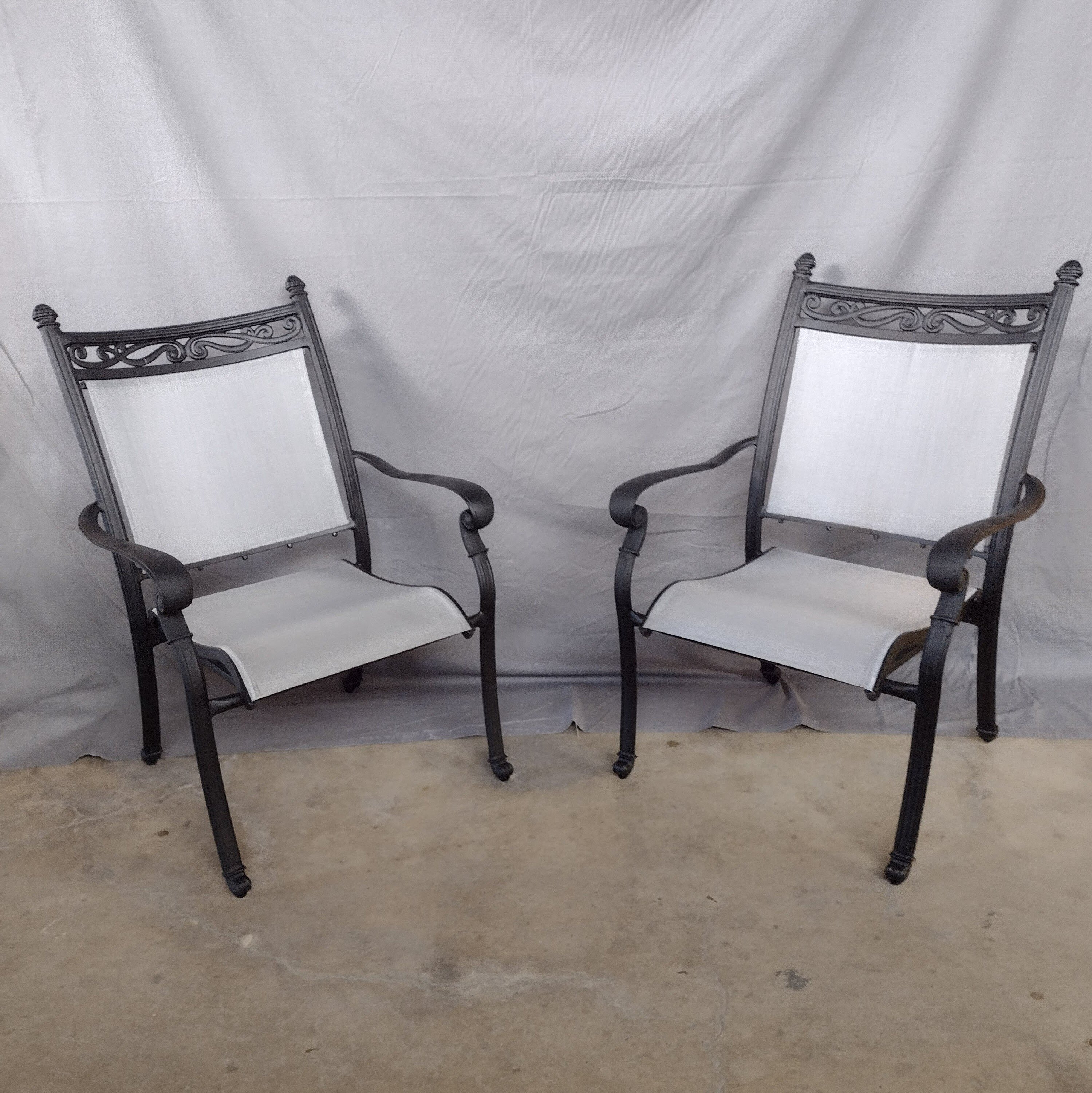 Vintage antique style black outdoor furniture chairs newly restored with new grey sling and new powder coat paint by patio guys