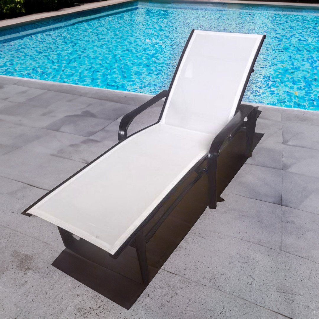 newly restored outdoor chaise lounge by a pool. New white sling and new black powder coat by patio guys
