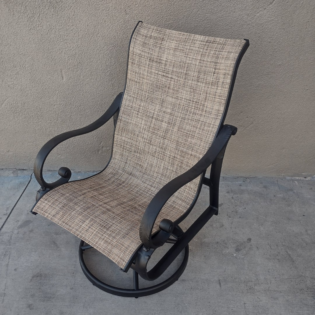 Black outdoor swivel chair with tan sling after full restoration and resling by patio guys-  furniture refinishers