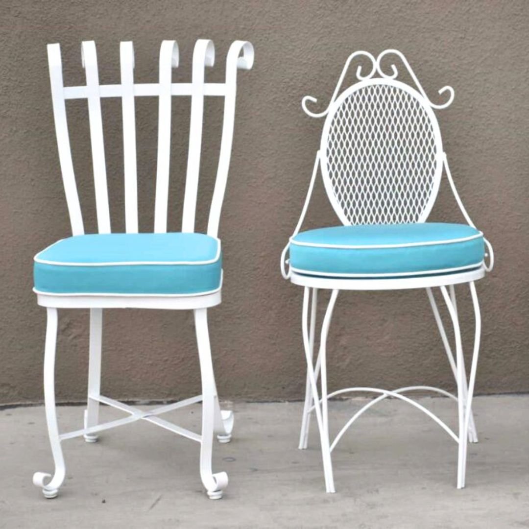 Blue Custom Outdoor Cushions made with sunbrella fabric on two metal white patio chairs - Patio Guys