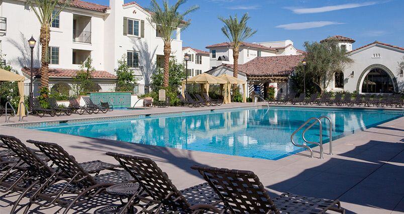 Image of Irvine Company pool with cross strap patio furniture