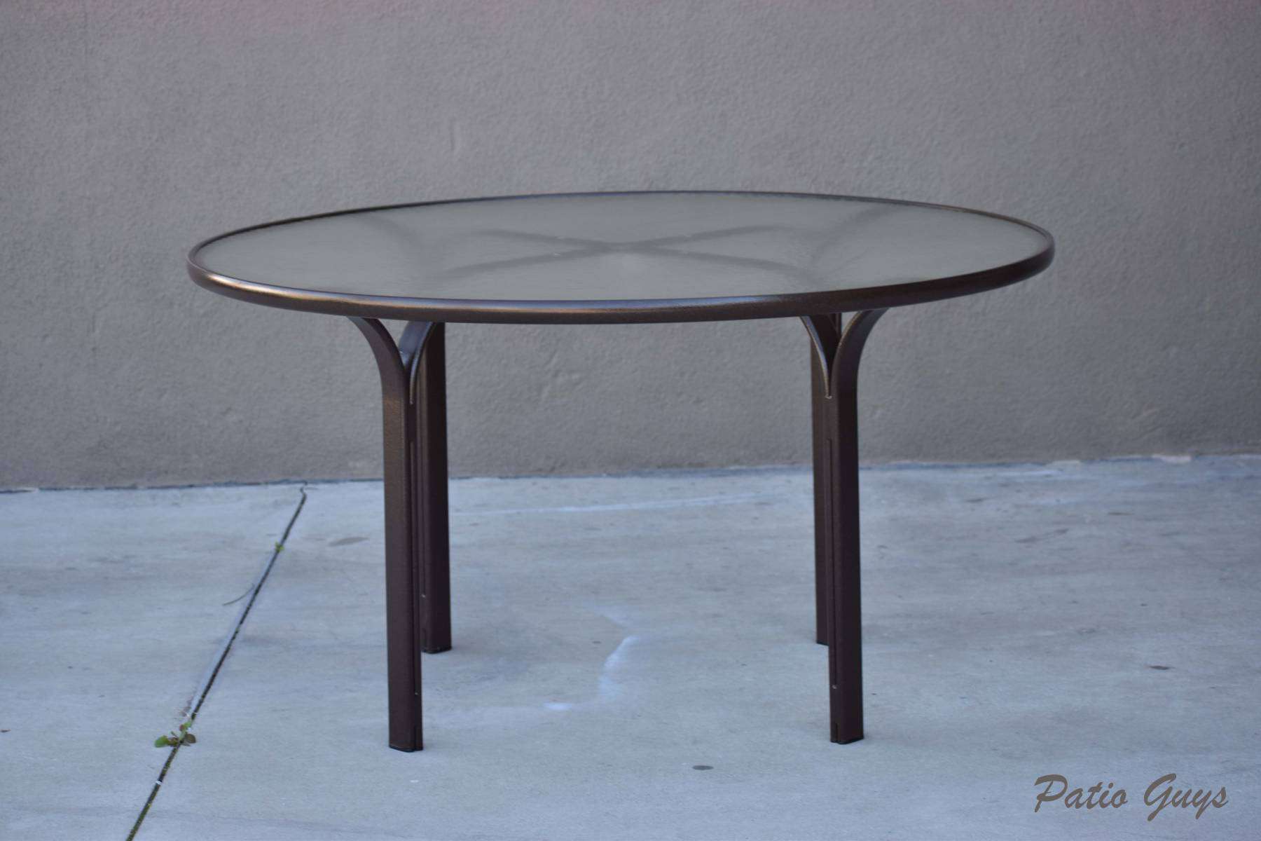 Large brown round acrylic dining table