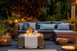 Outdoor Patio Couch with Cousions and lit candles