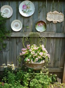 Vintage Metal Chair with Flowers and Vintage Plates in 2023 designed outdoor space