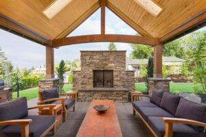 Arrange Patio Furniture with Brick Fireplace Focal Point