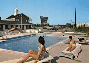 1950s pool with vintage patio furniture lounges